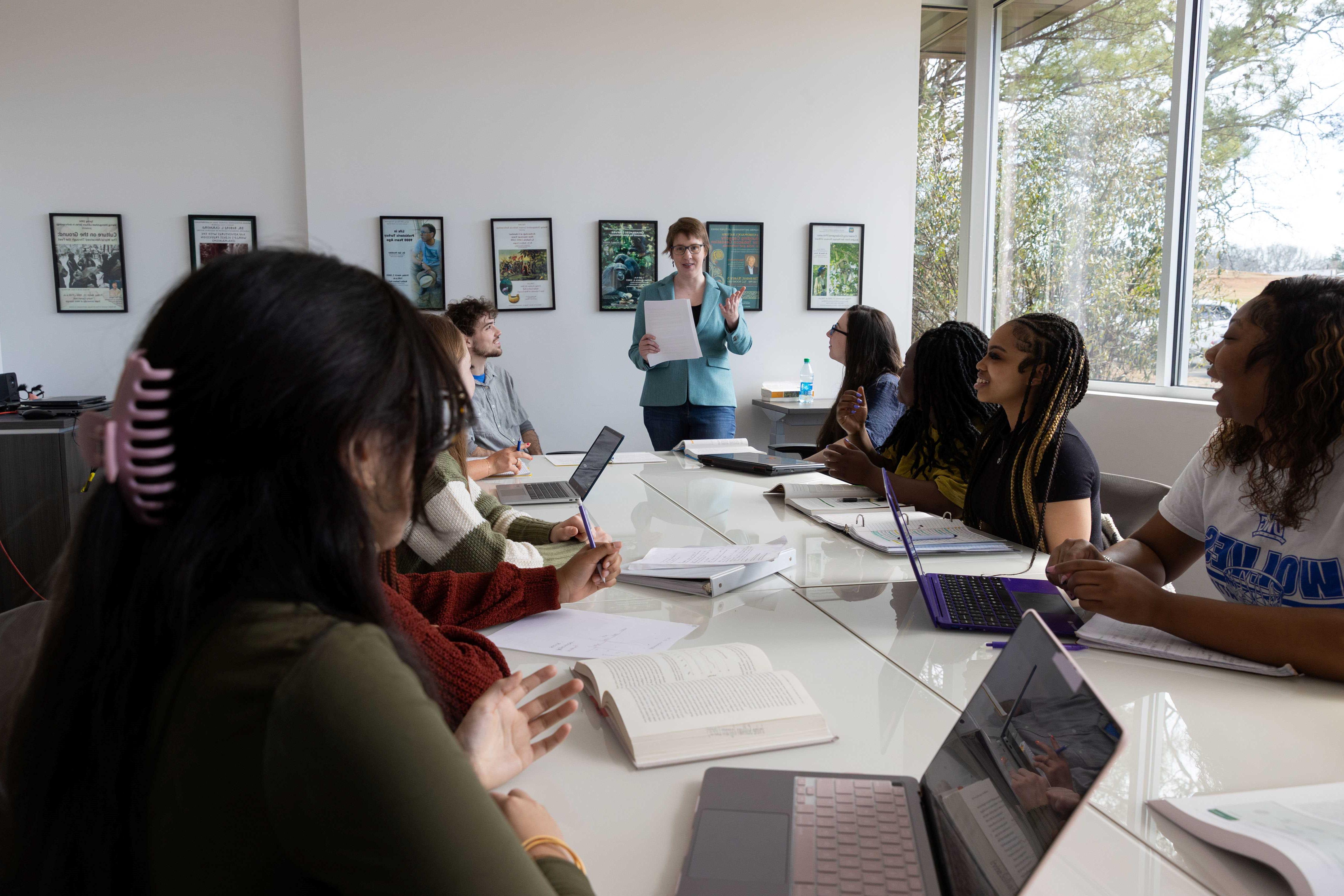 Professor teaching in a classroom full of students.